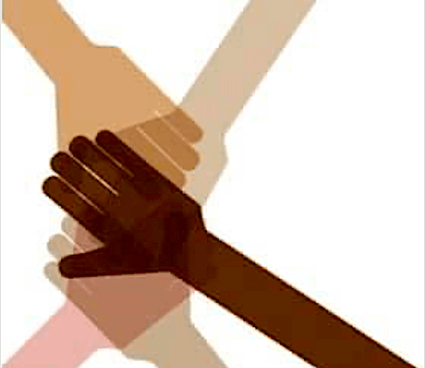 Multi-racial hands grasping each other