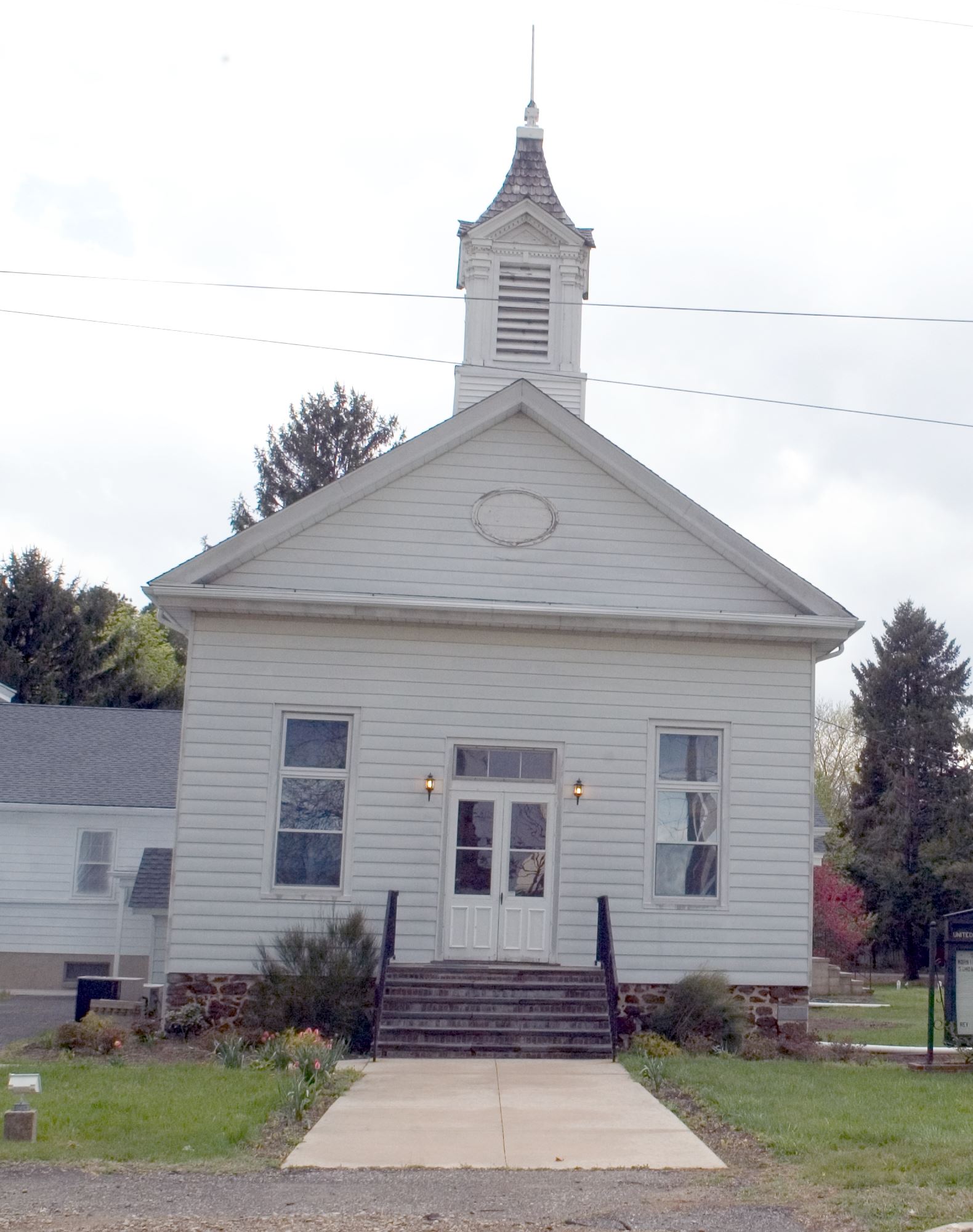 White Church with Brick Staircase Entrance