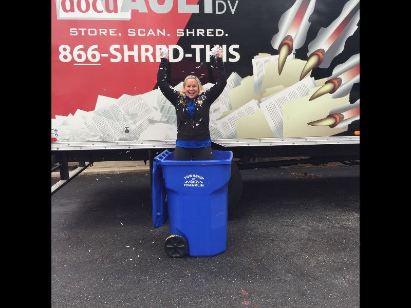 Heather Flaim standing in recycling bin at recycling event